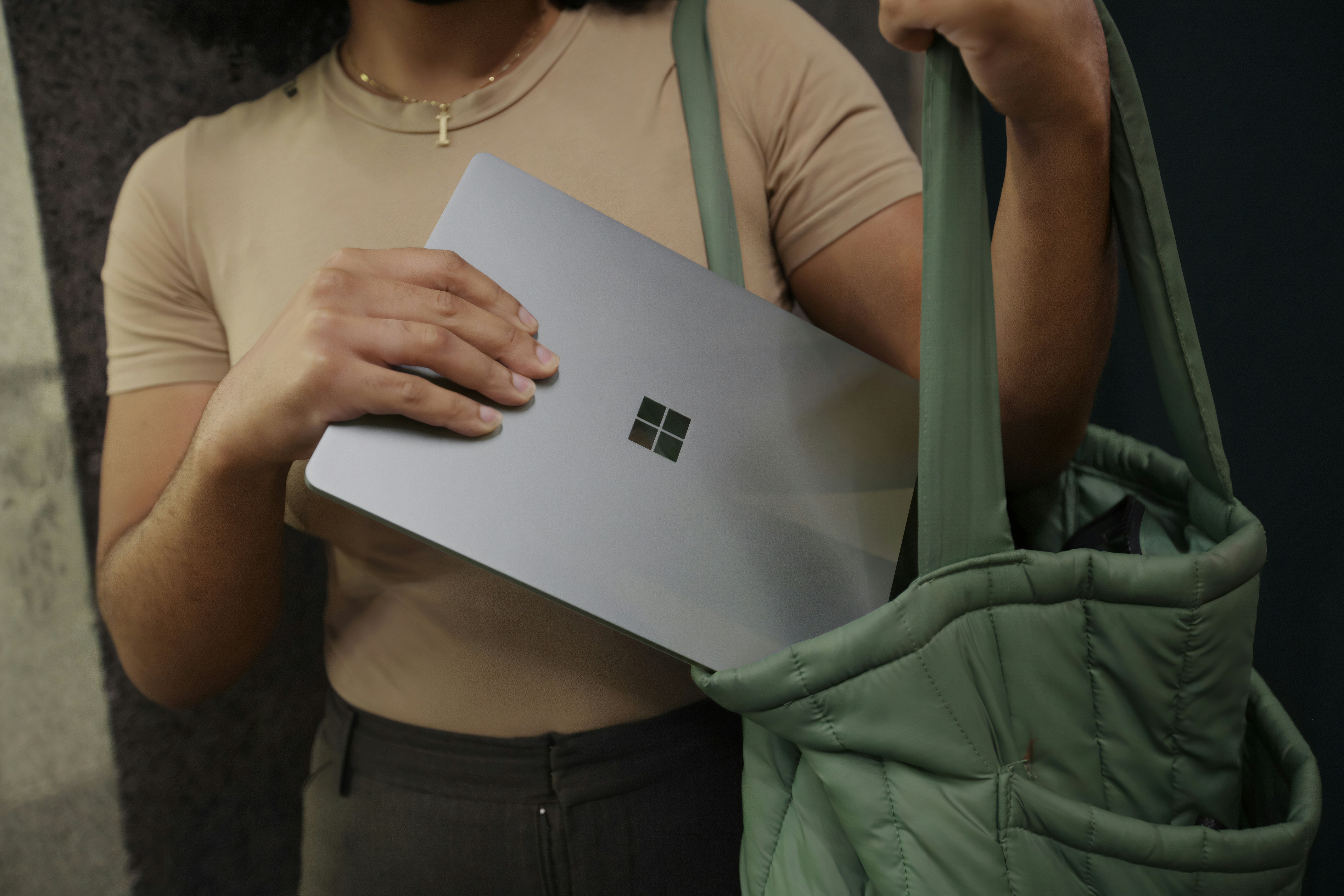 A close-up of a new Microsoft Surface Laptop Go 3 with a budget price tag displayed
