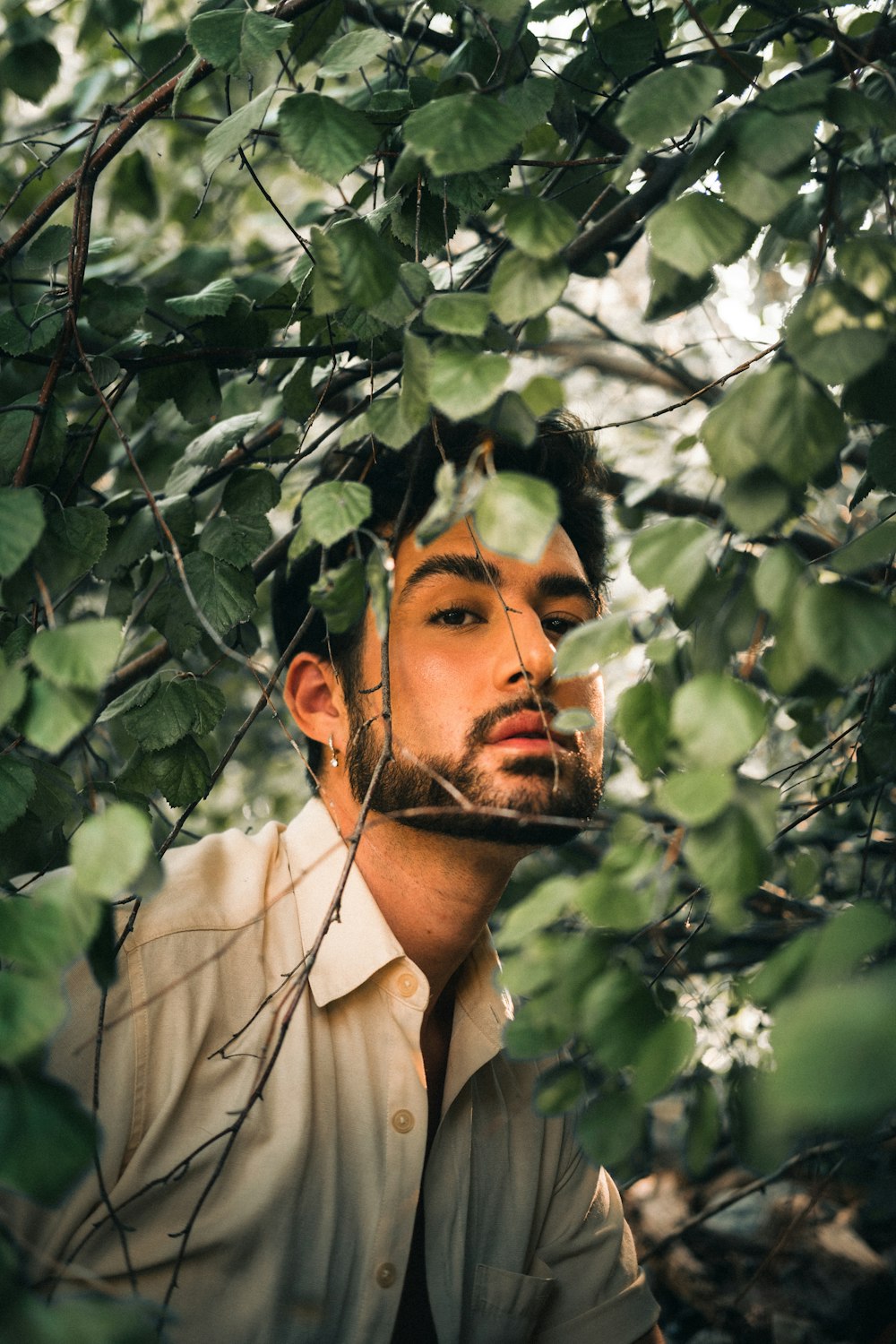 a man with a beard and a white shirt