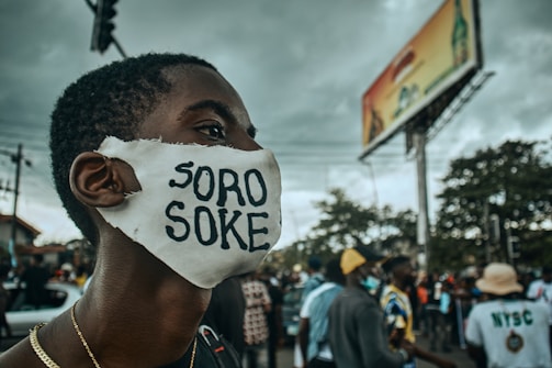 a man wearing a face mask with the word soro soke written on it