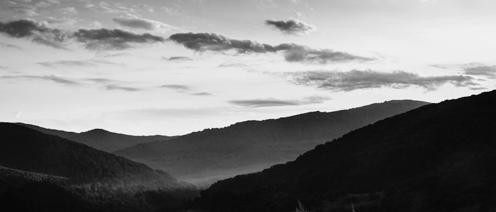 a black and white photo of a mountain range