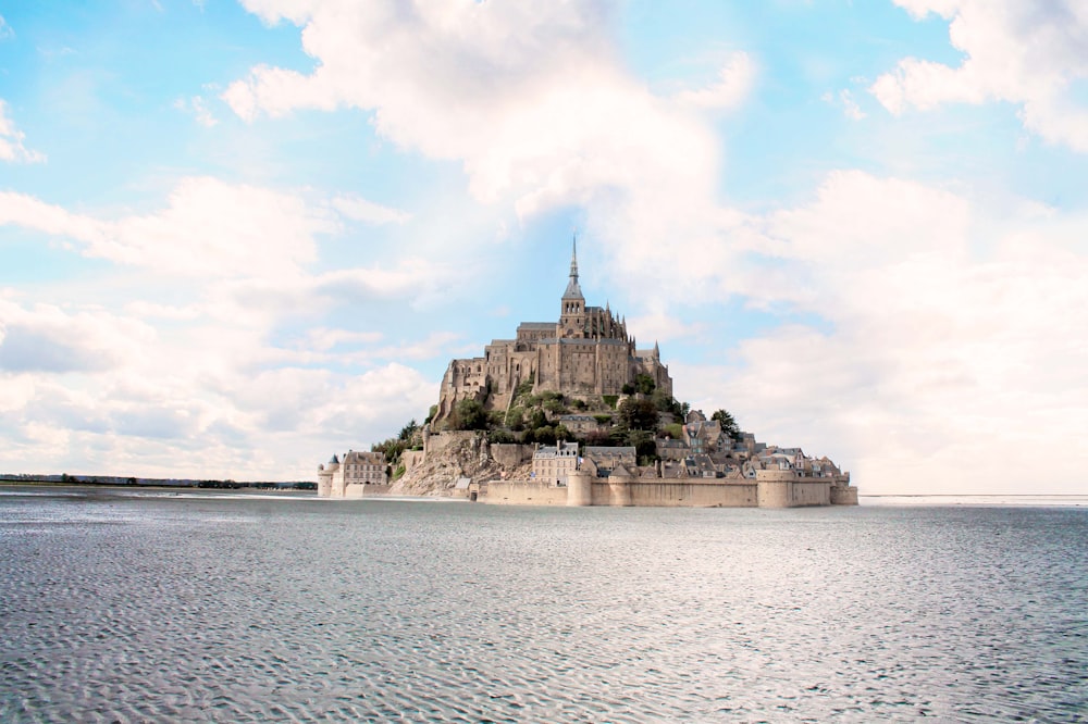 a large castle sitting on top of a large body of water