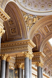 the ceiling of a building with many columns