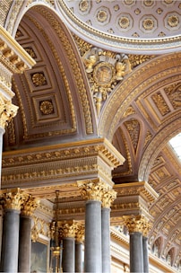 the ceiling of a building with many columns