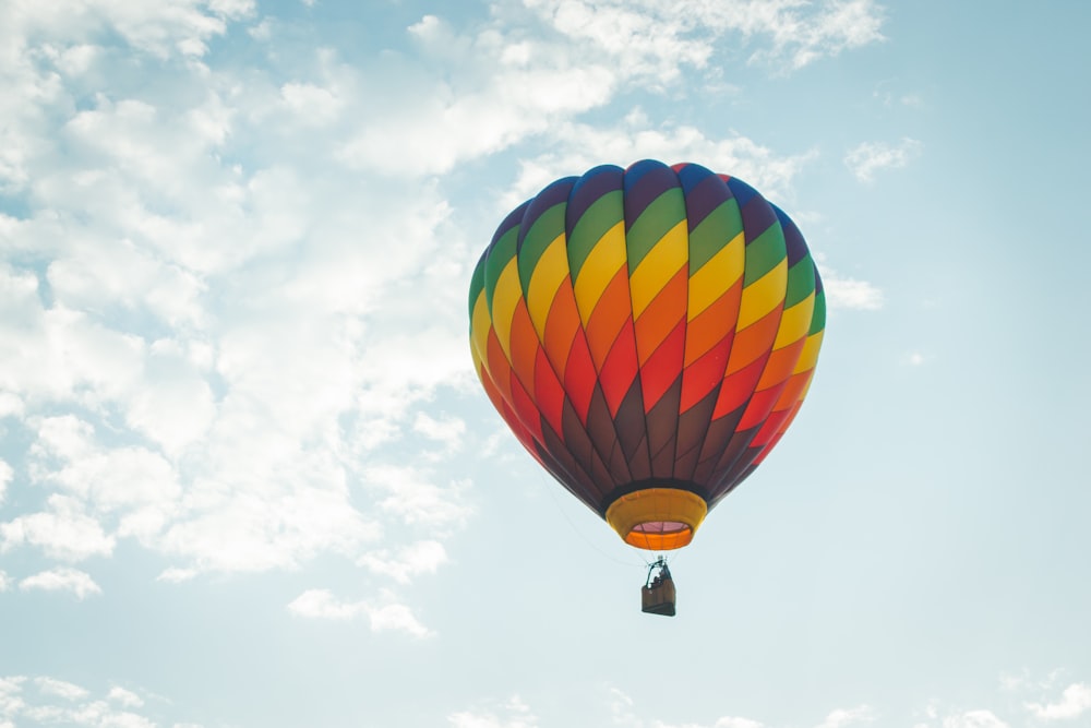 a colorful hot air balloon flying in the sky