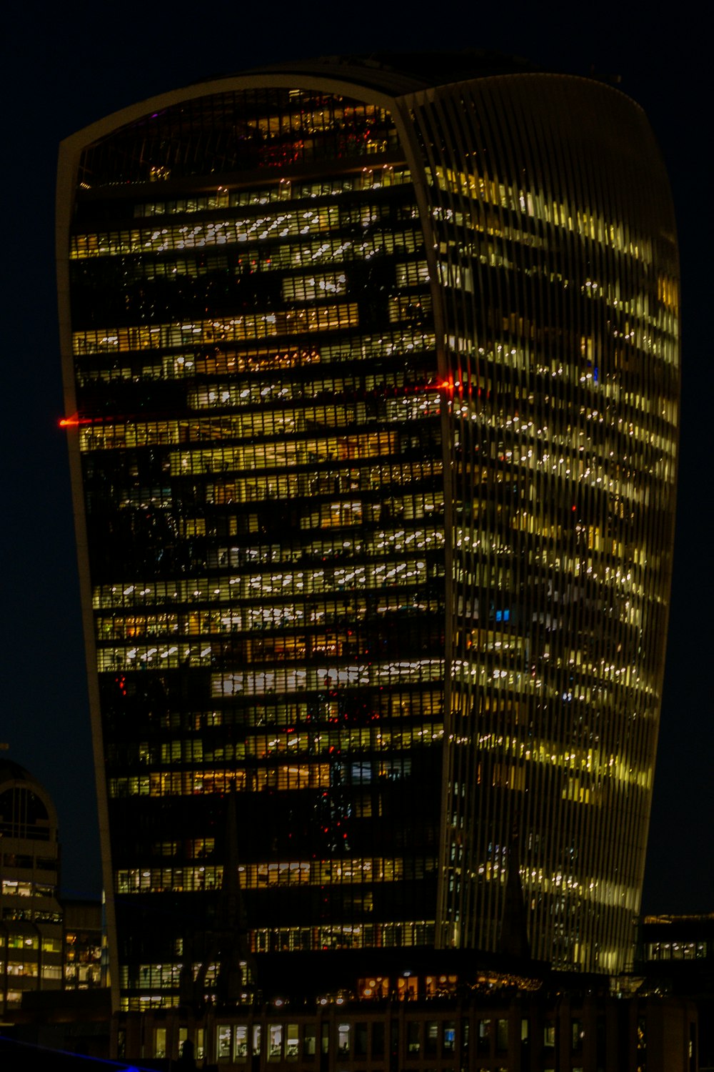 a very tall building lit up at night