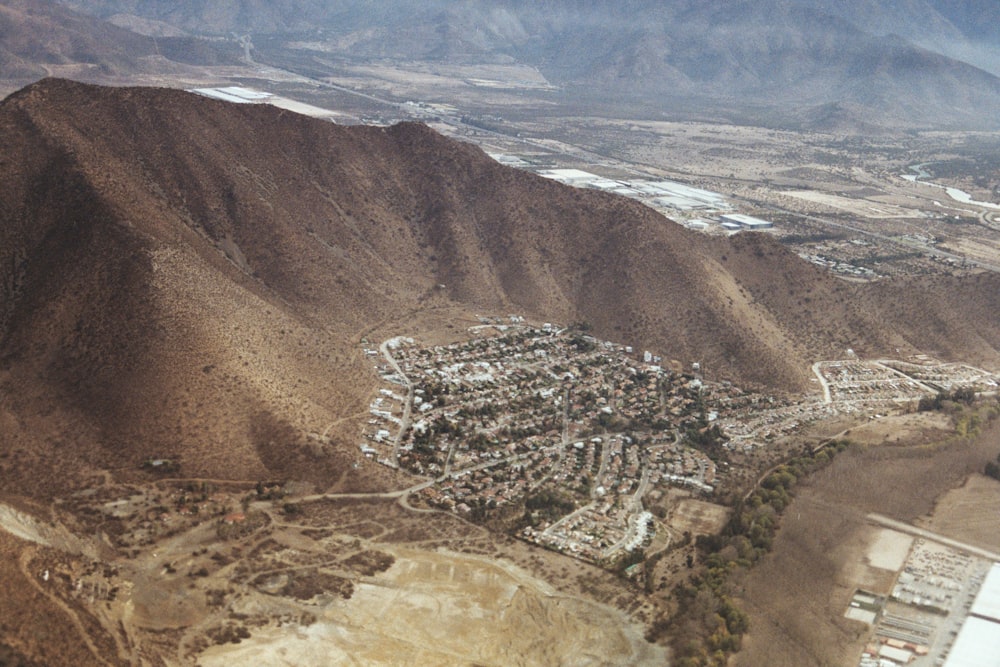 an aerial view of a city in the mountains