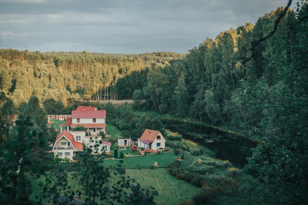 an aerial view of a house surrounded by trees