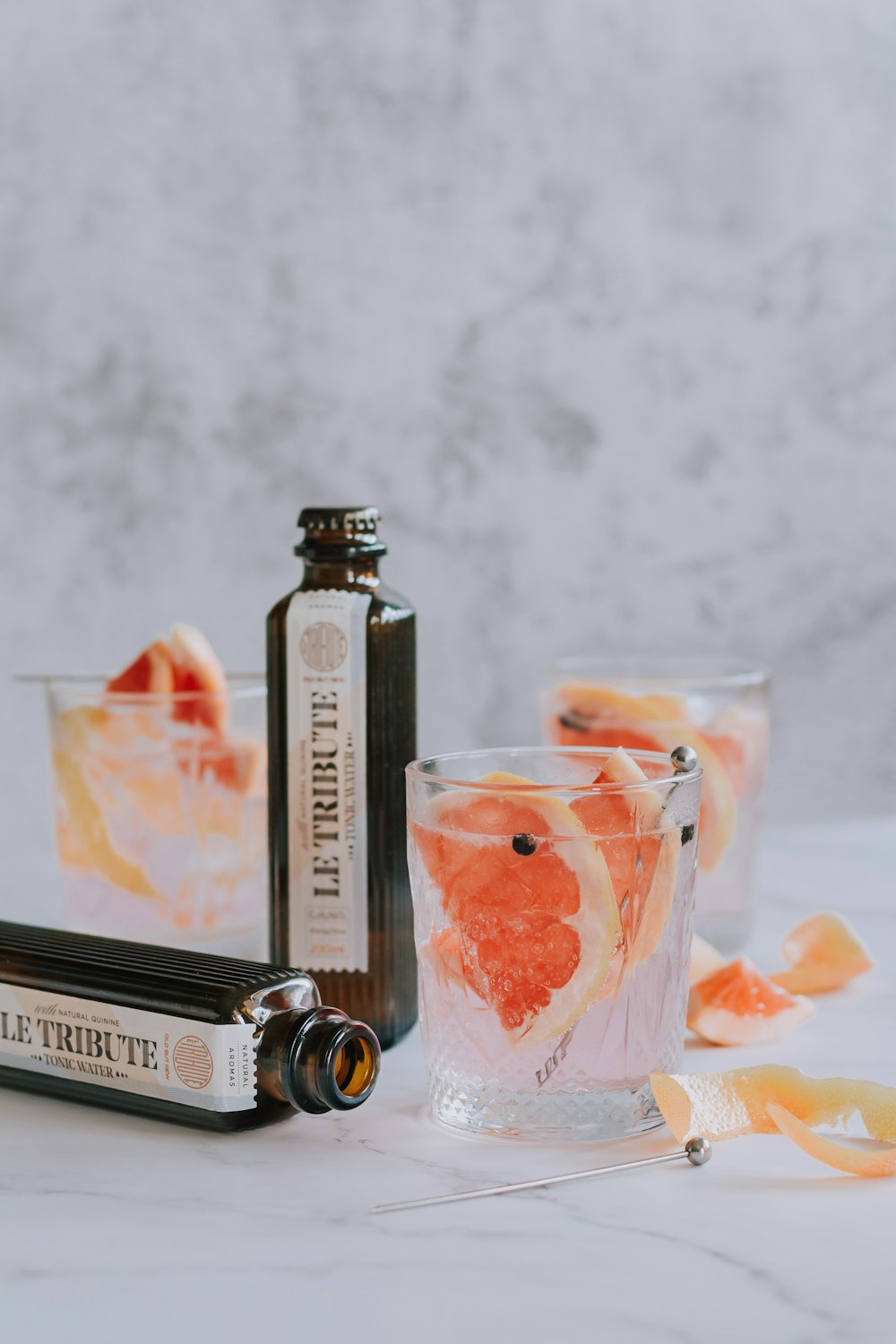 a bottle of orange liqueur next to a glass of orange liqueur