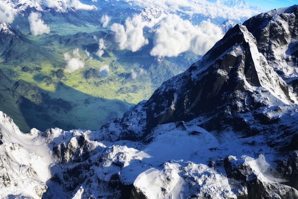 the view from the top of a snowy mountain