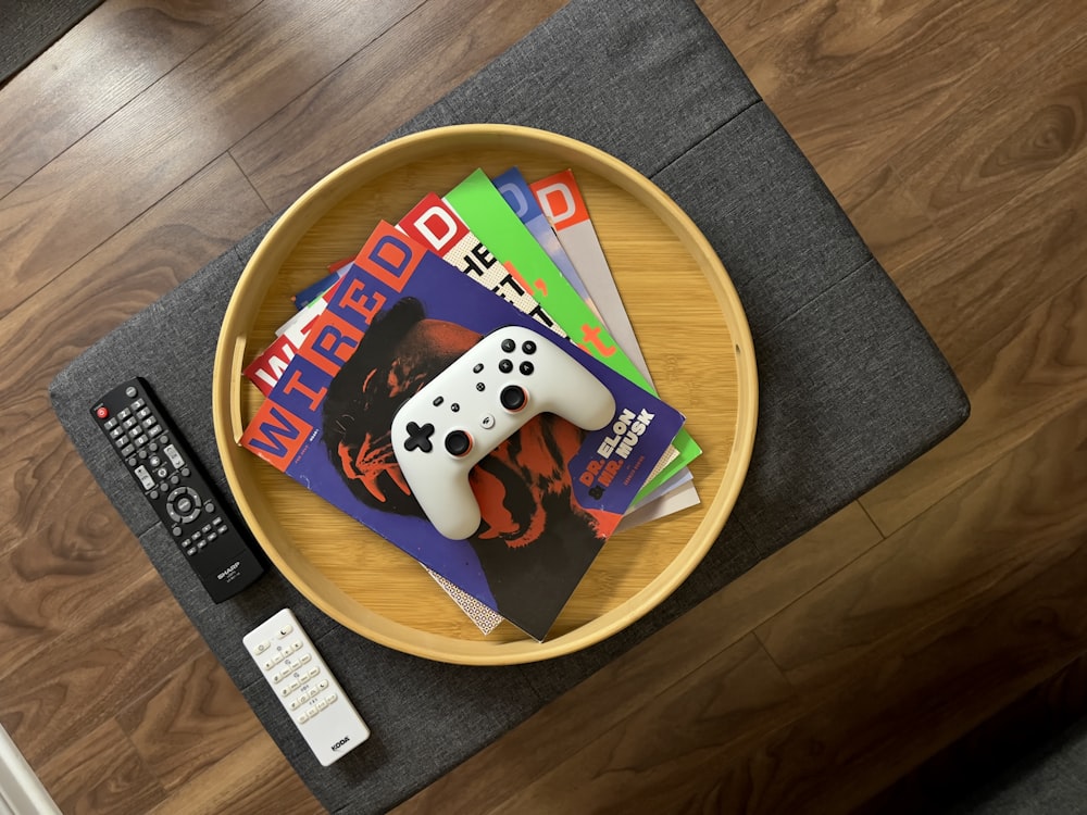 a remote control sitting on top of a wooden table