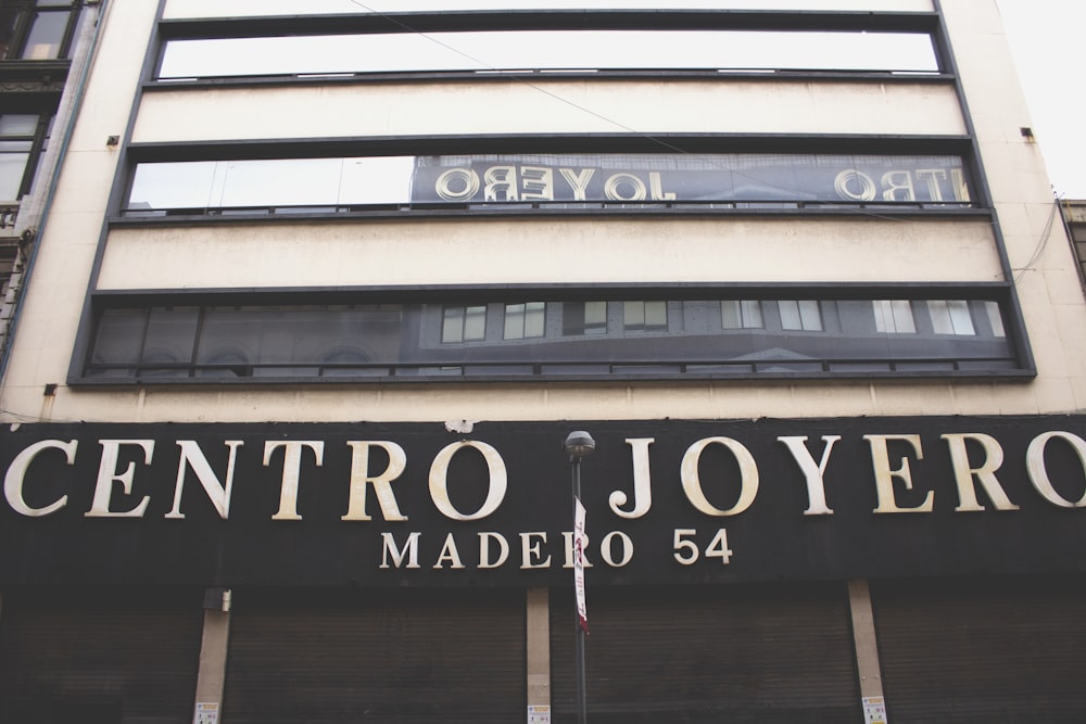 a tall building with a sign on the front of it