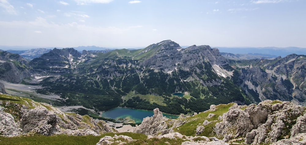 a view of a mountain range with a lake in the middle