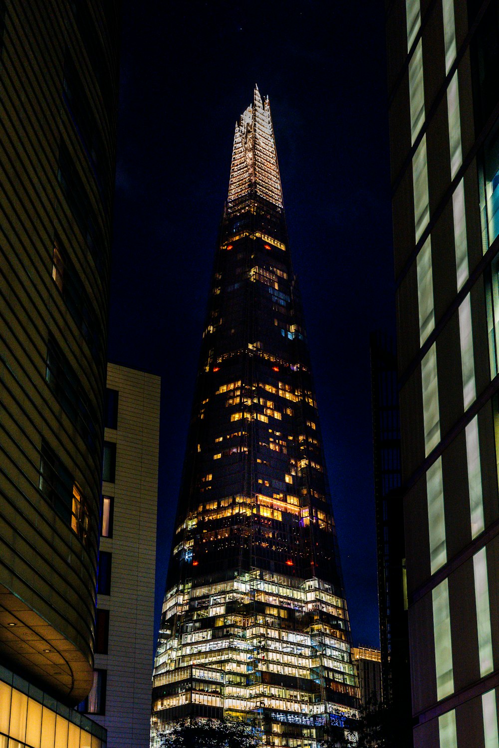 a very tall building lit up at night