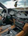 A comfortable car interior showing a friendly driver ready for an outstation trip.