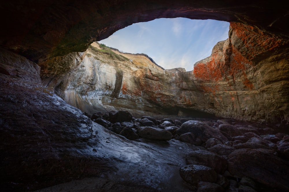 a cave with a small stream running through it