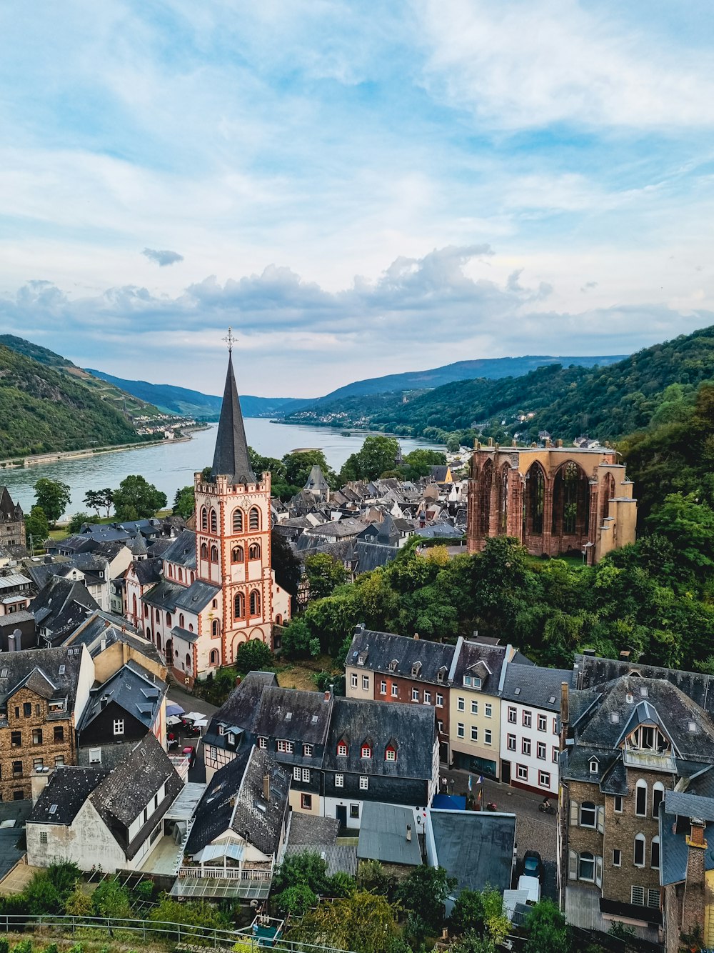 a view of a town with a river in the background