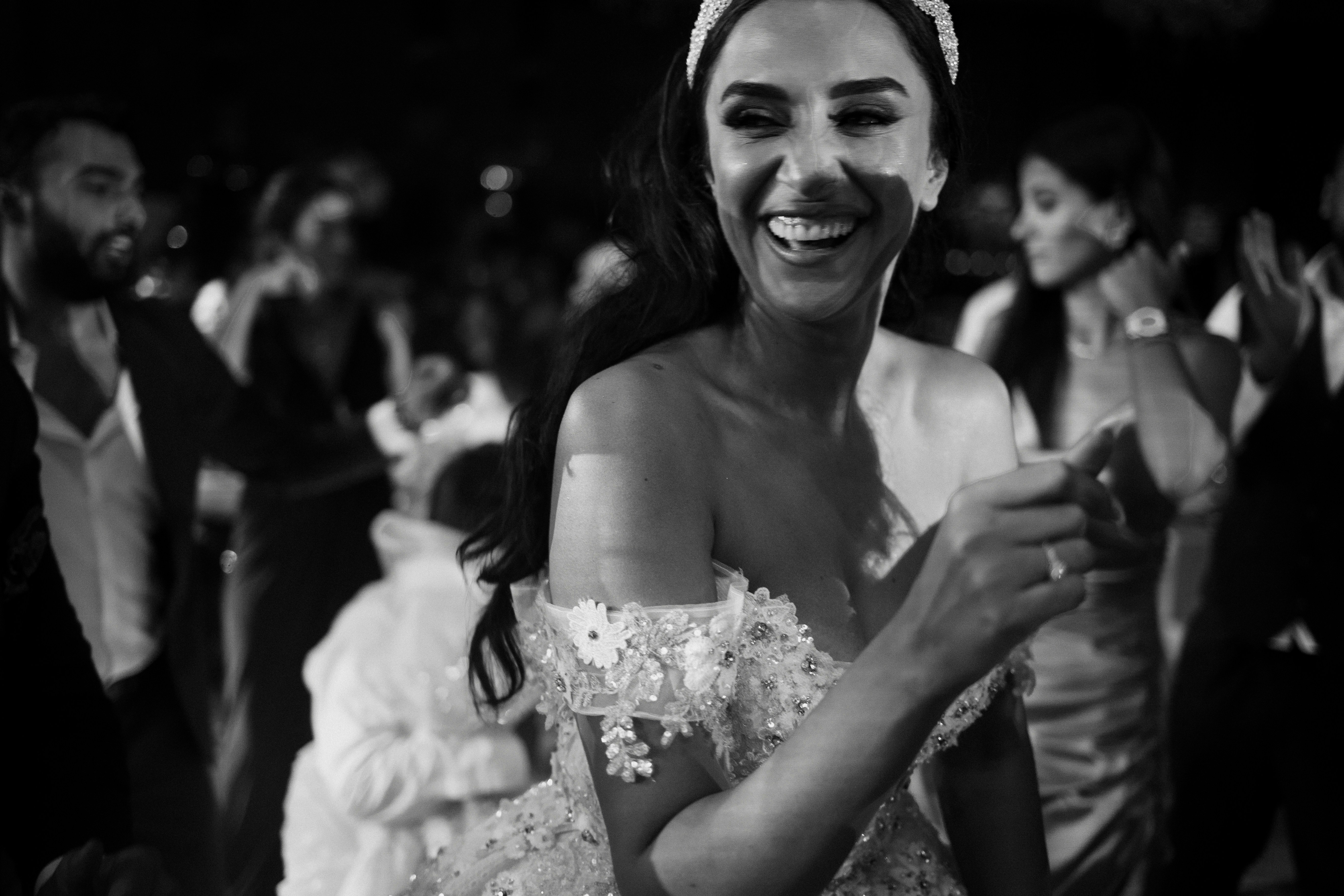 A black and white photo of a woman in a wedding dress