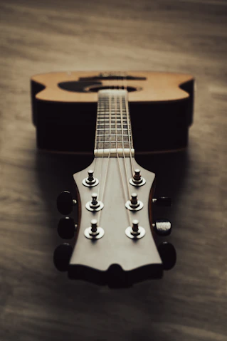 a close up of a guitar on a table