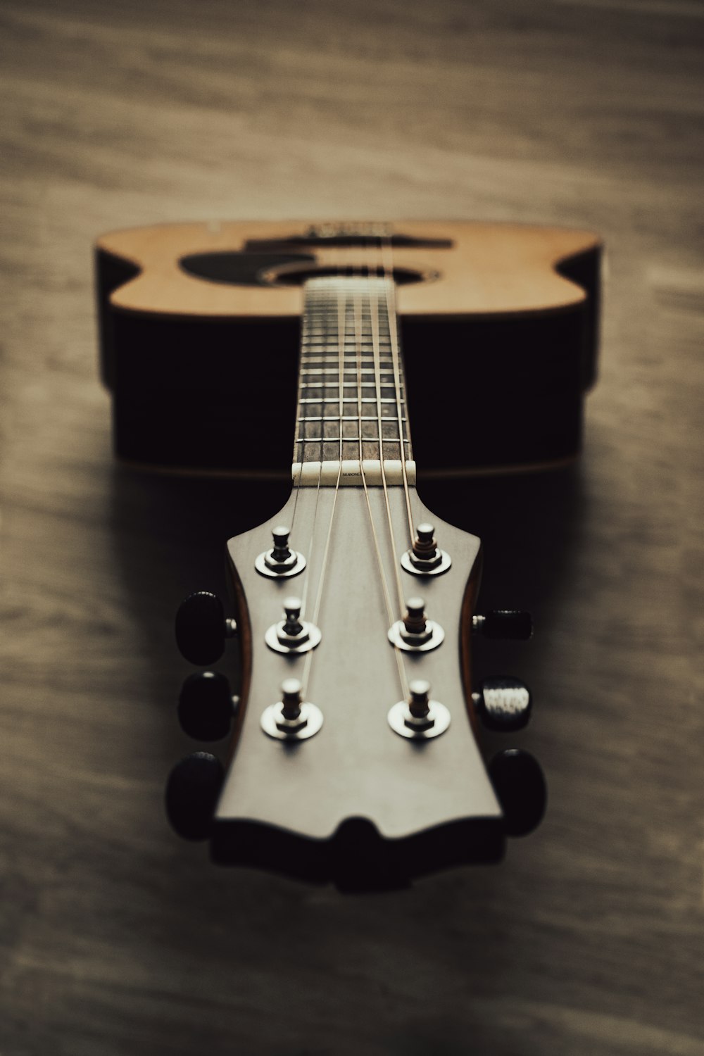 a close up of a guitar on a table