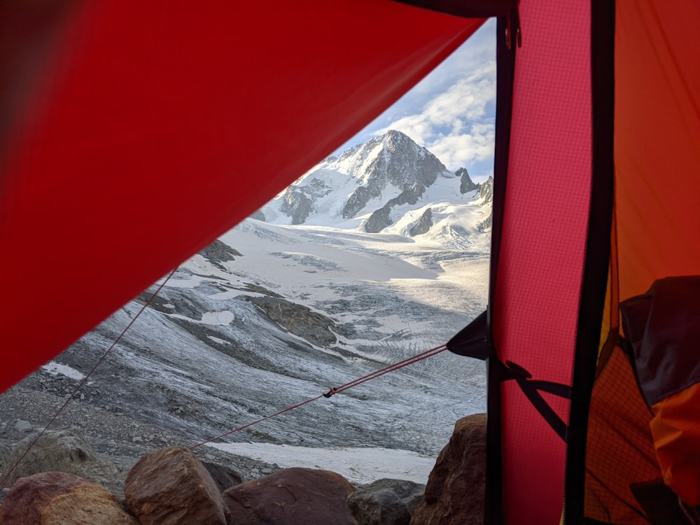 a view of a mountain from inside a tent