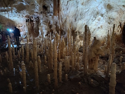 Close-up of a guided tour group exploring the underground caves beneath Épernay.