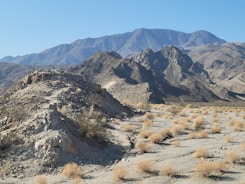 a mountain range in the middle of a desert