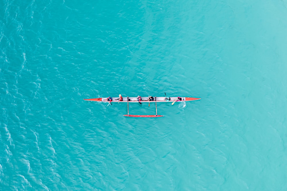 an aerial view of a boat in the ocean