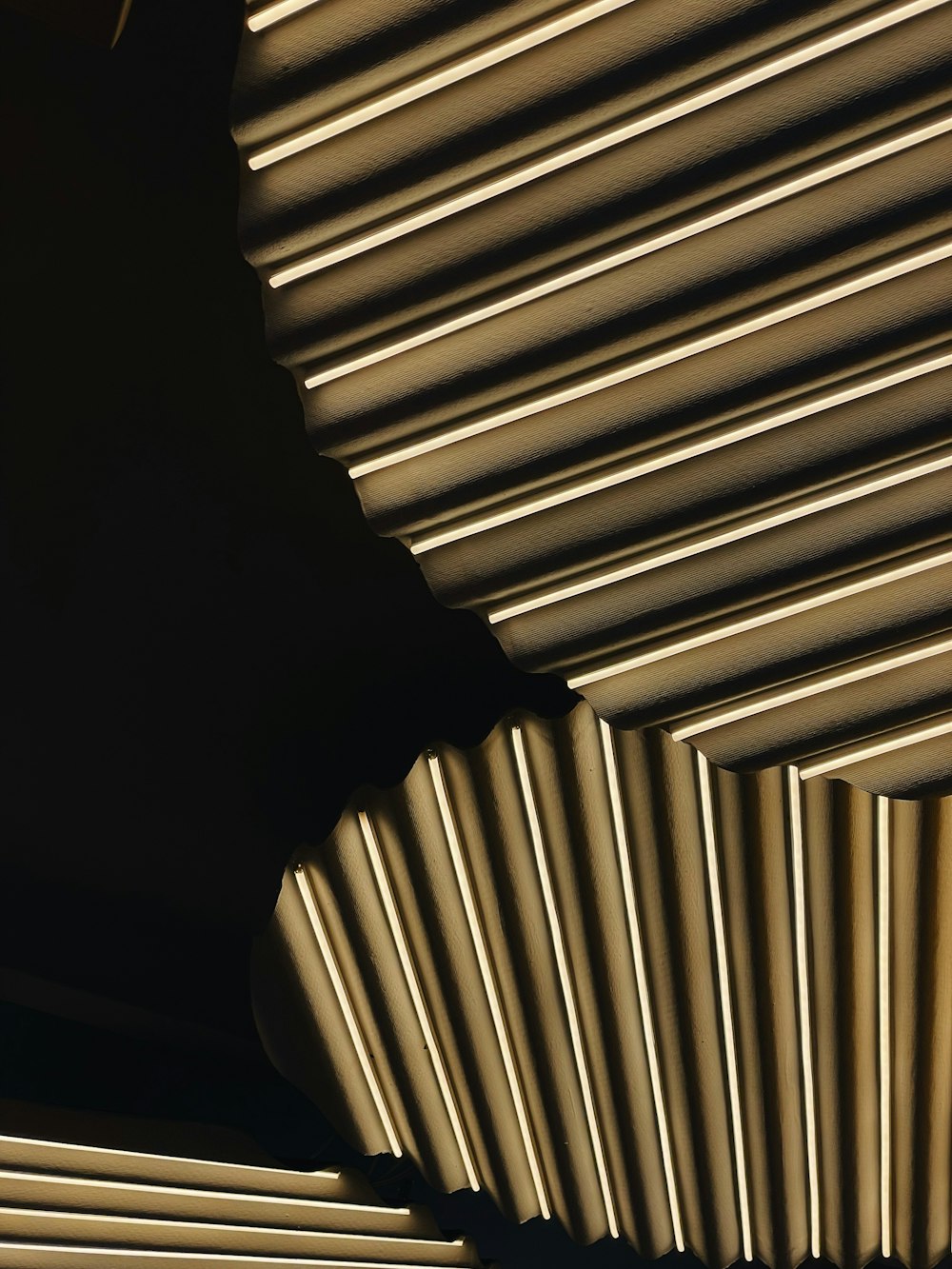 a close up of a ceiling made of metal pipes