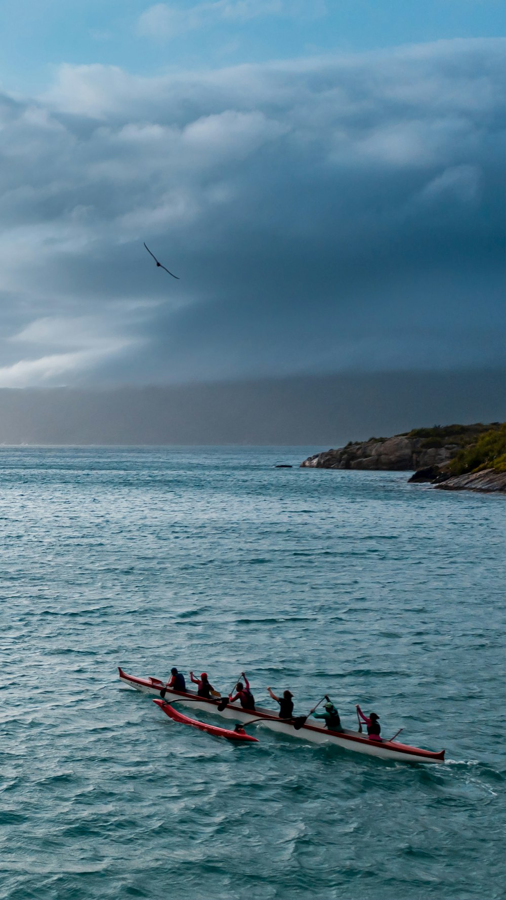 a group of people on a boat in the water