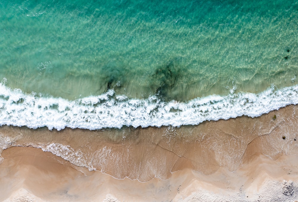 an aerial view of a beach and ocean