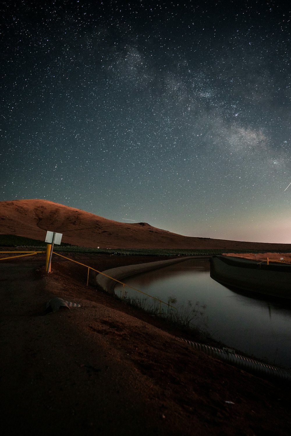 the night sky over a body of water