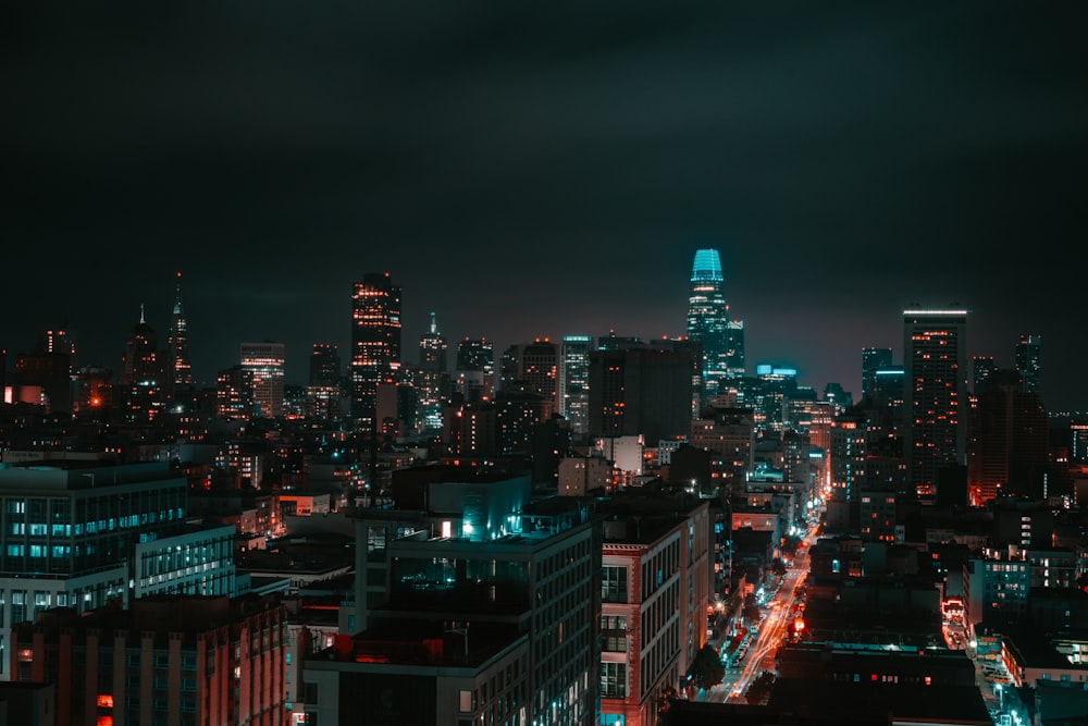 a view of a city at night from the top of a building