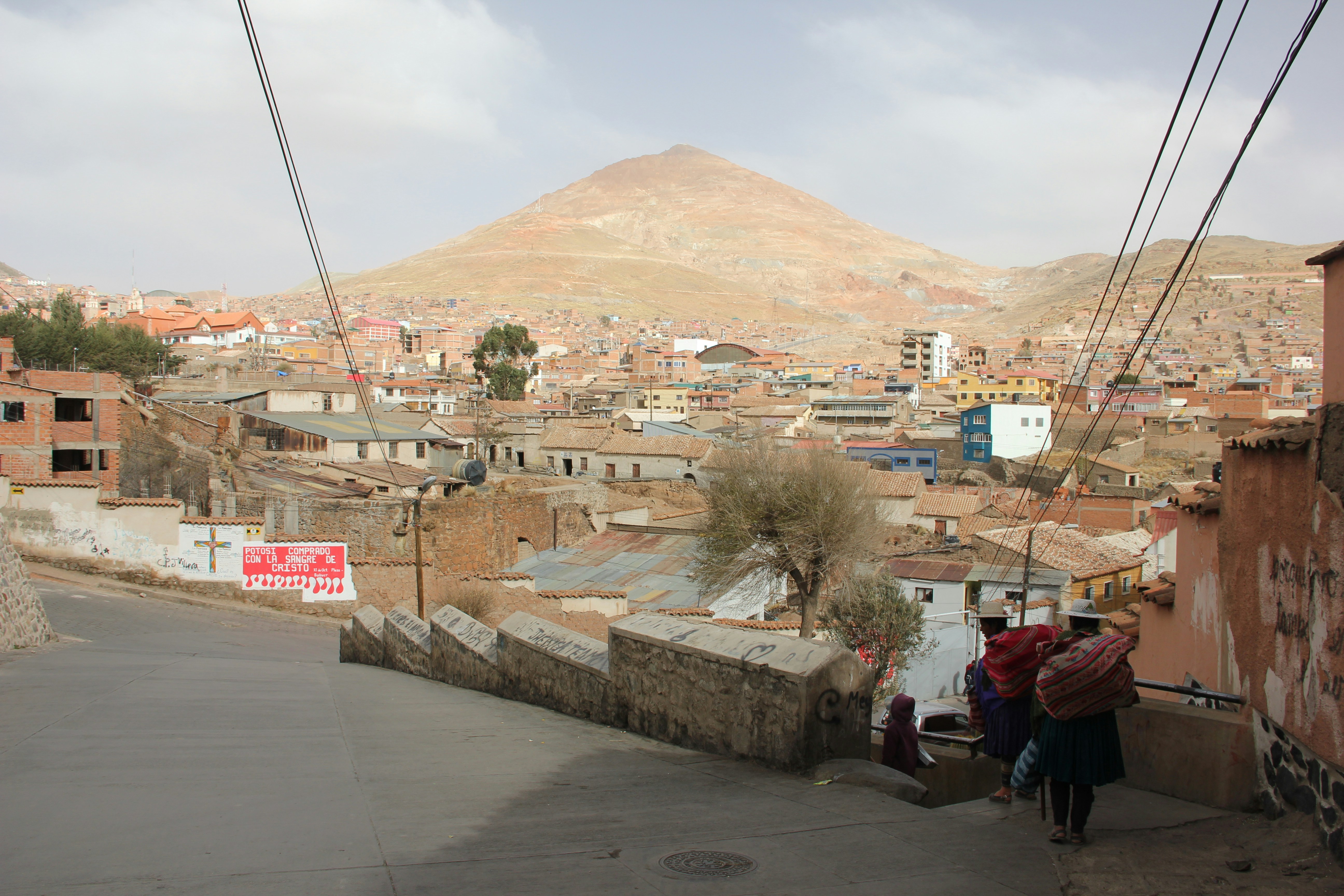 a couple of people walking down a street