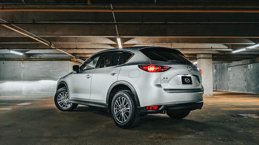 a white car parked in a parking garage