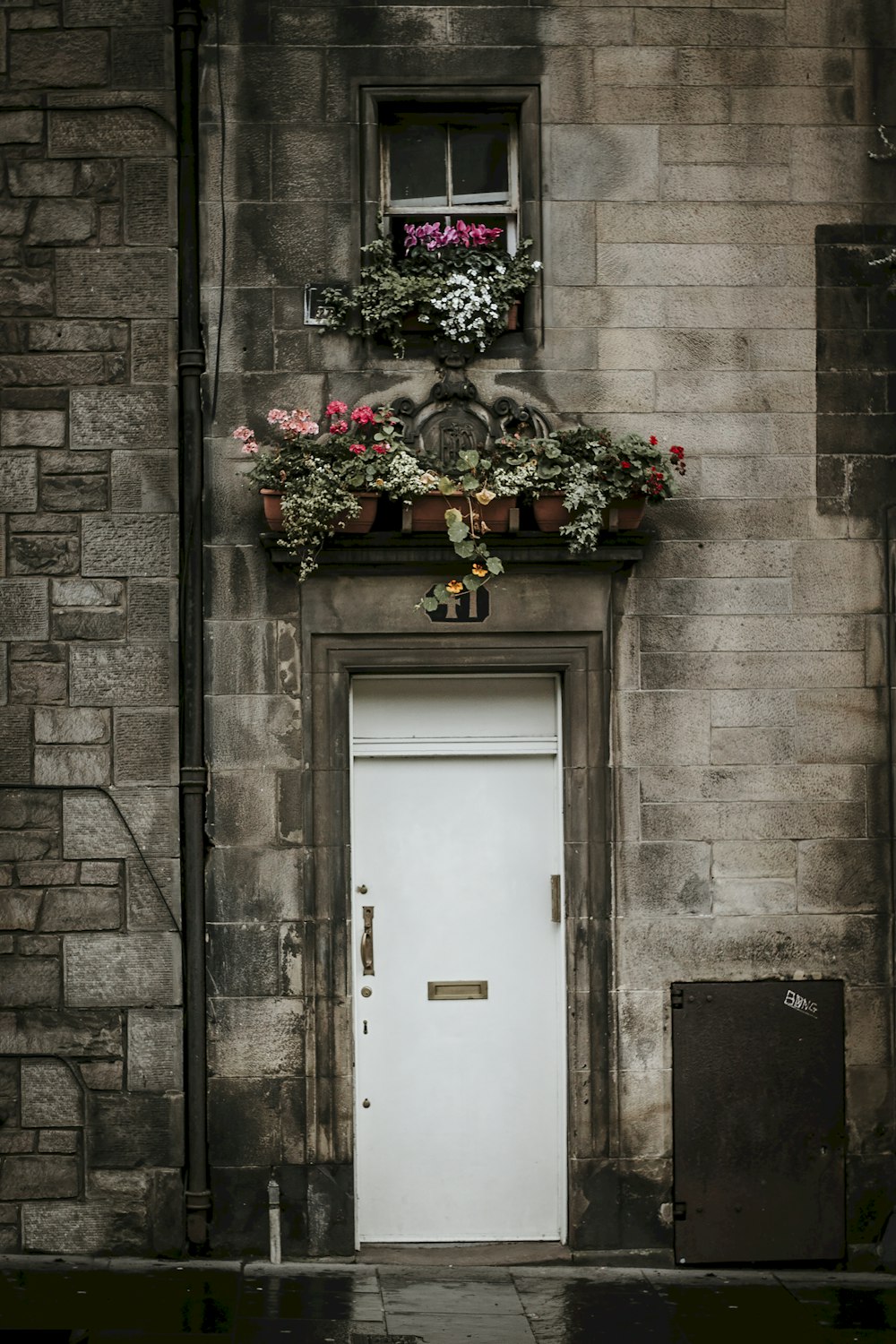 a white door with a planter on top of it