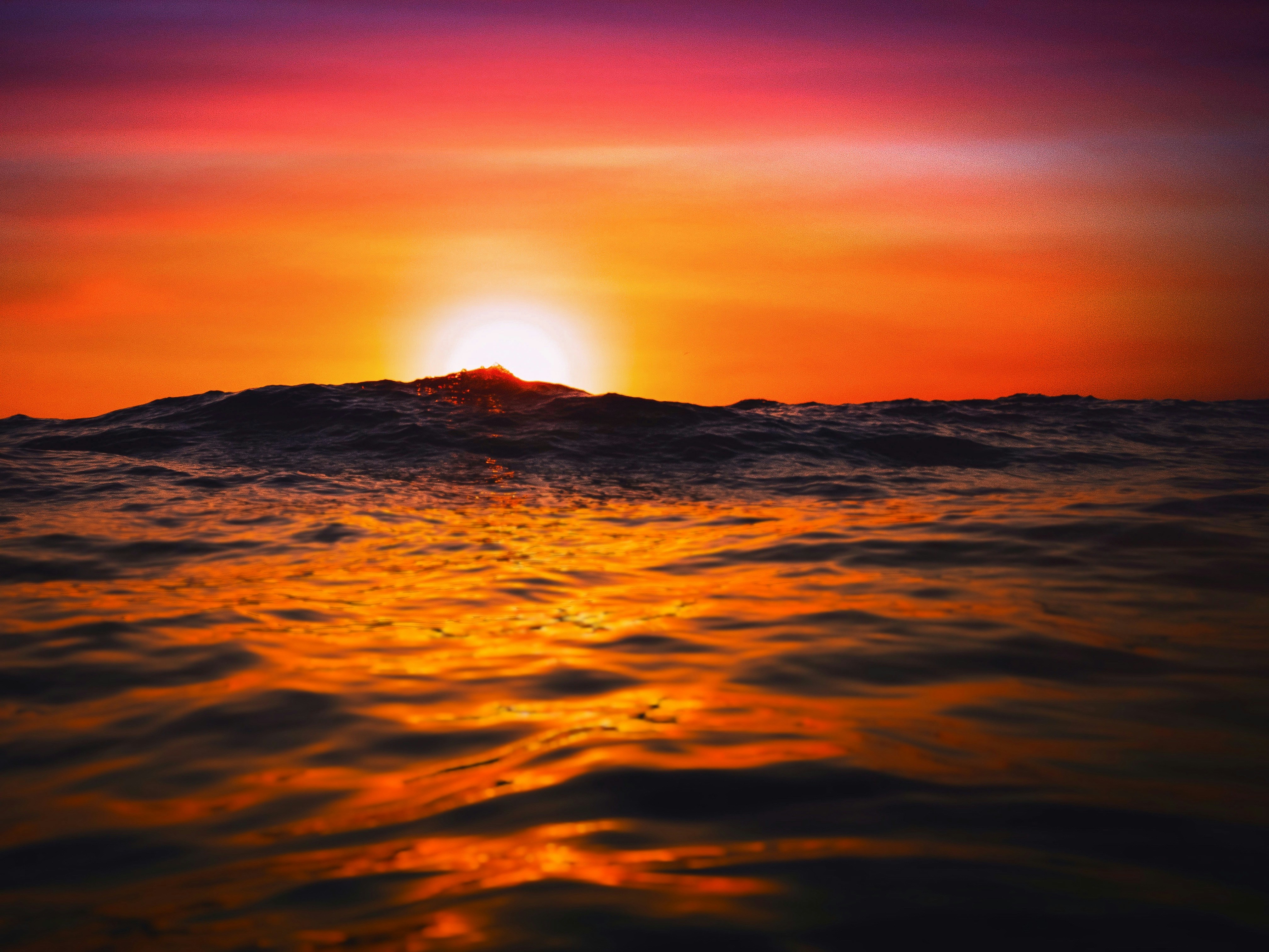 the sun is setting over the ocean as it reflects in the water, Golden Moments