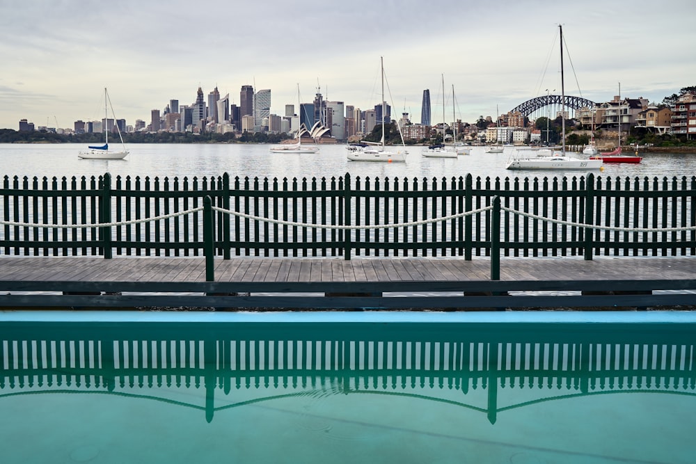 a swimming pool with a view of a city in the background