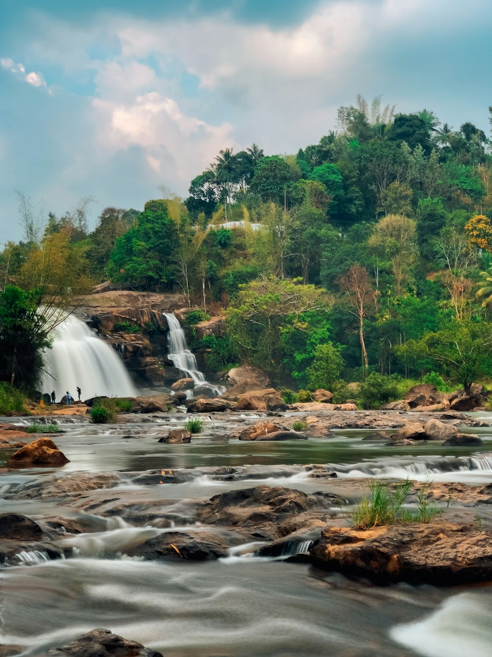 a river with a waterfall in the middle of it