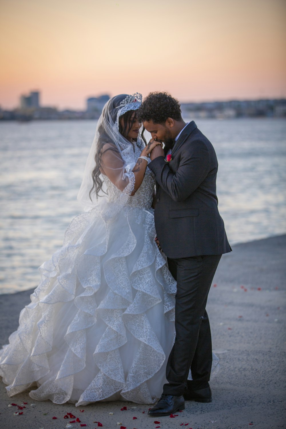 a bride and groom standing next to each other