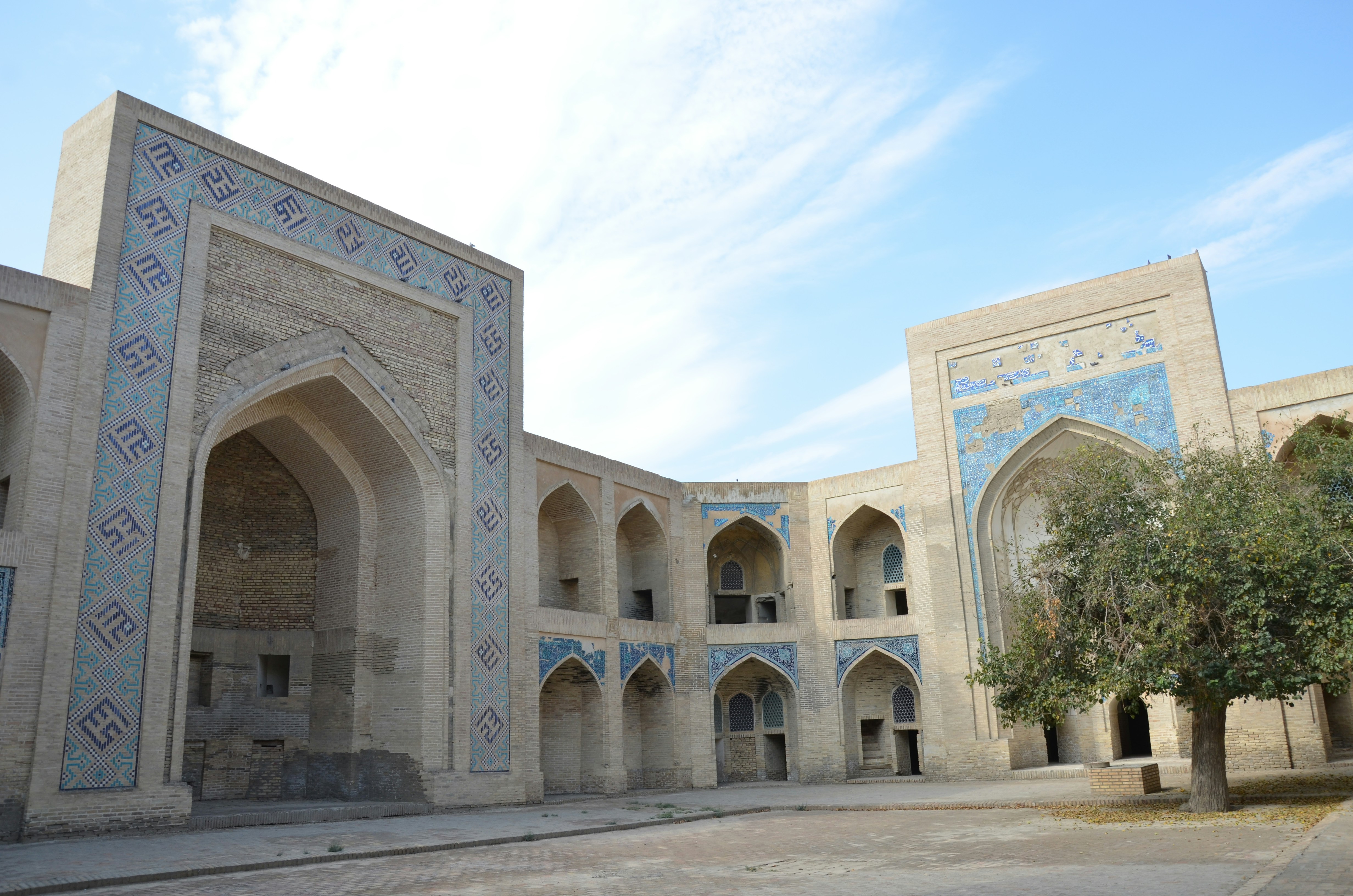 a large building with a tree in front of it