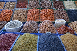 a variety of beans and rice are on display