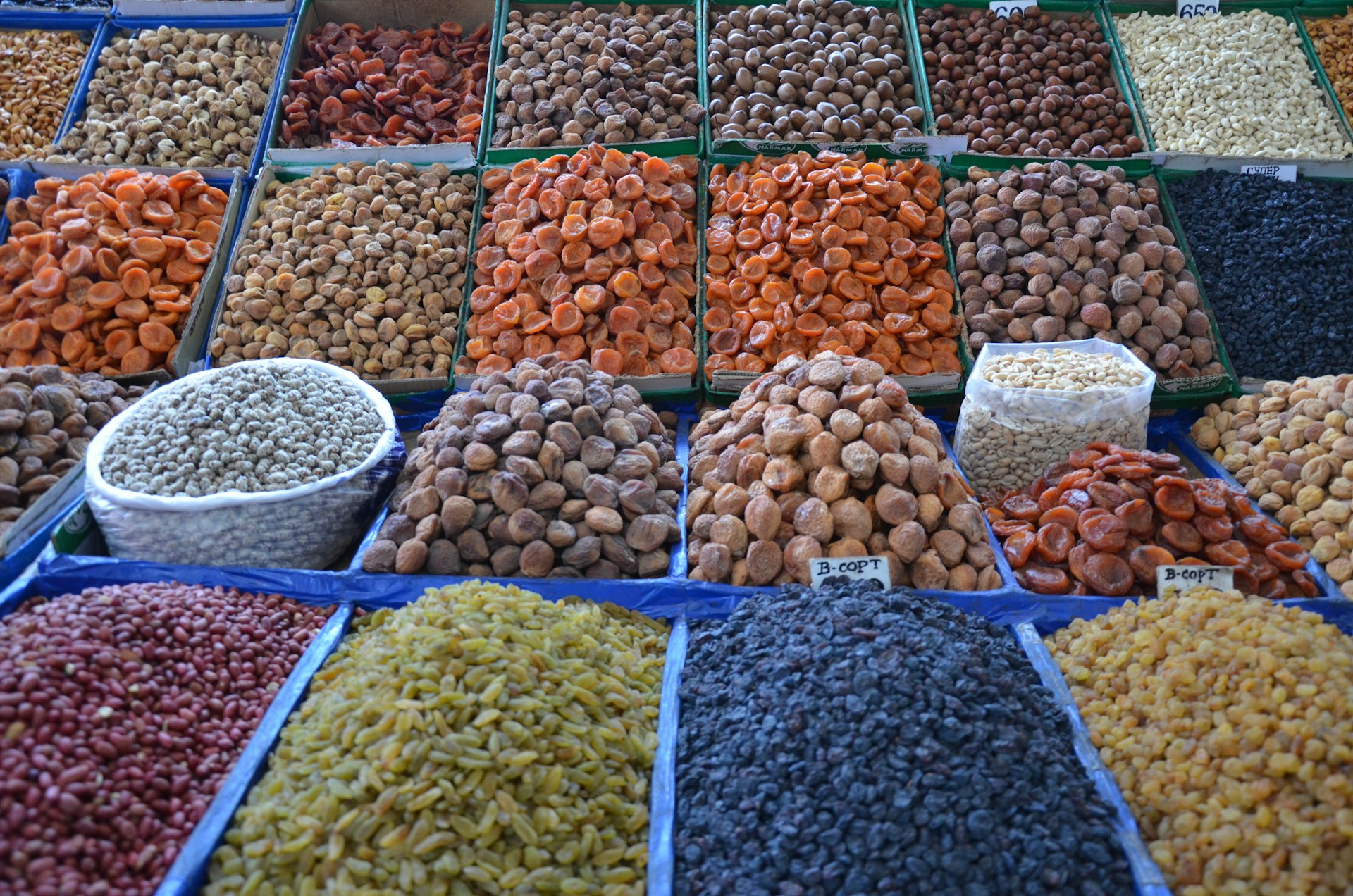 a variety of beans and rice are on display