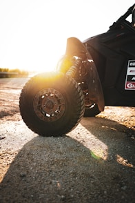 a close up of a vehicle on a dirt road