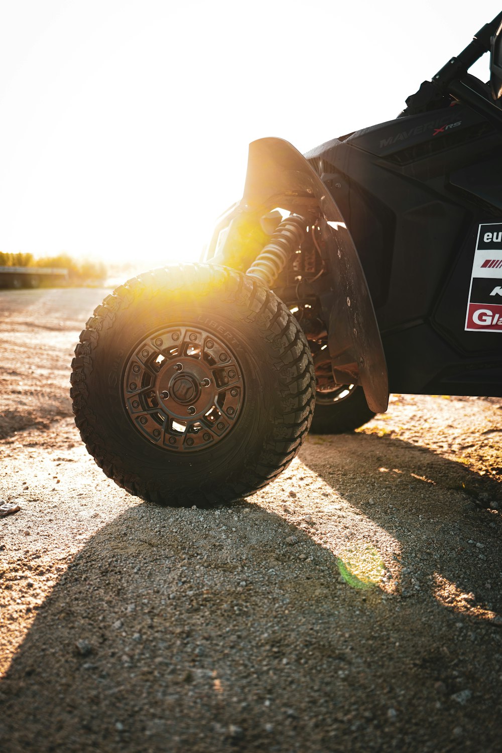 a close up of a vehicle on a dirt road