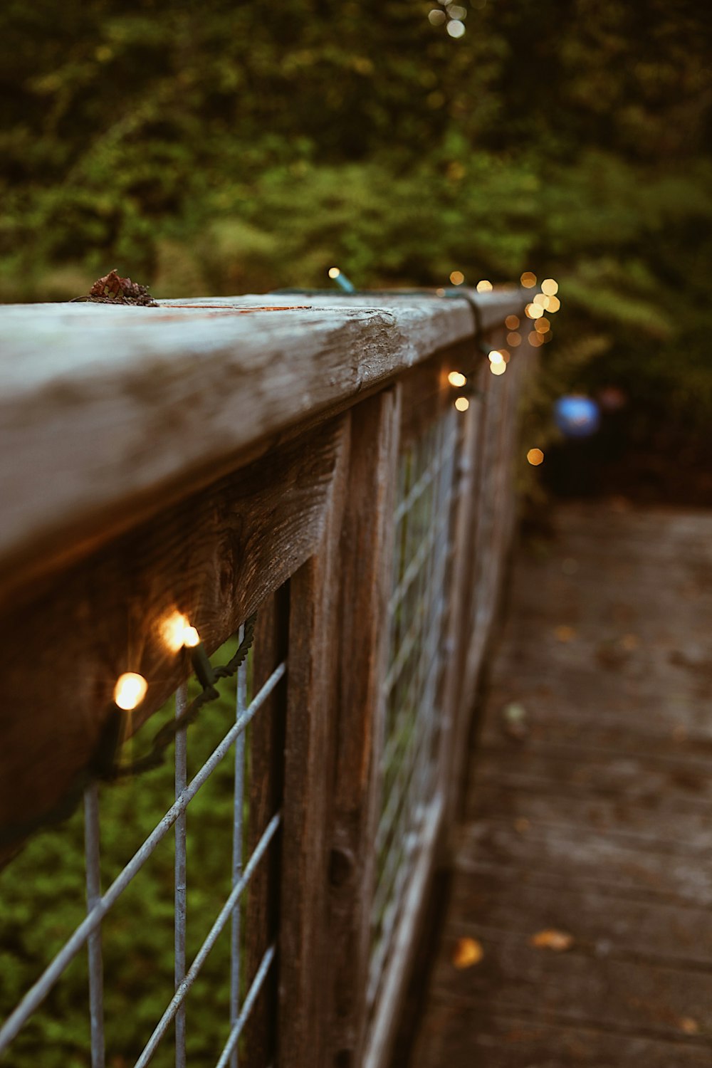 a close up of a fence with lights on it