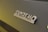 Close-up view of a 'Sanremo Coffee Machines' logo on a dark surface.
