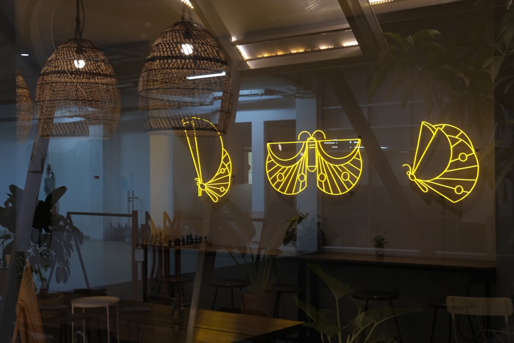 a window with yellow lights in a restaurant