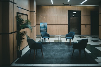 a couple of chairs that are in a room