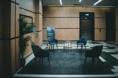 a couple of chairs that are in a room