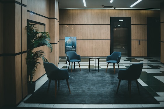 a couple of chairs that are in a room